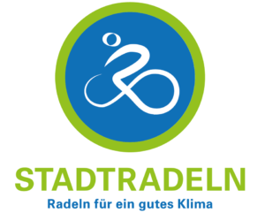 Logo der Kampagne STADTRADELN mit weißem Fahrradsymbol in einem blau-grünen Kreis und dem Slogan „Radeln für ein gutes Klima“.