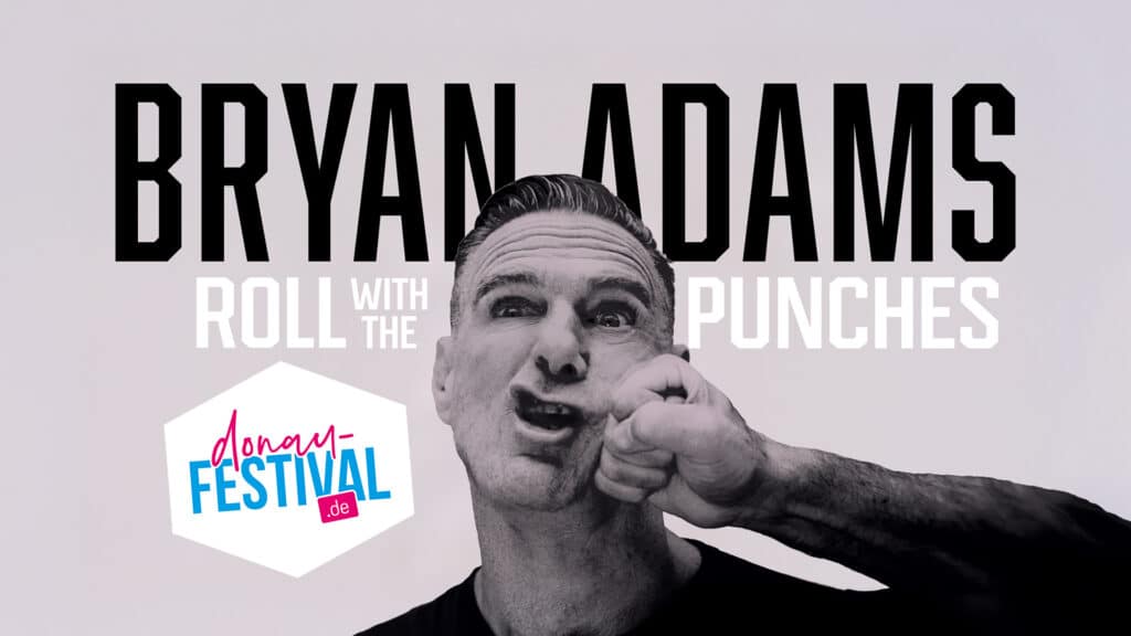 Schwarz-weiße Grafik mit dem Schriftzug „Bryan Adams – Roll with the Punches“, einem Porträt des Musikers und dem Logo „Donau Festival“.